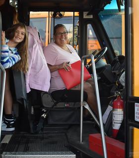 student with bus driver